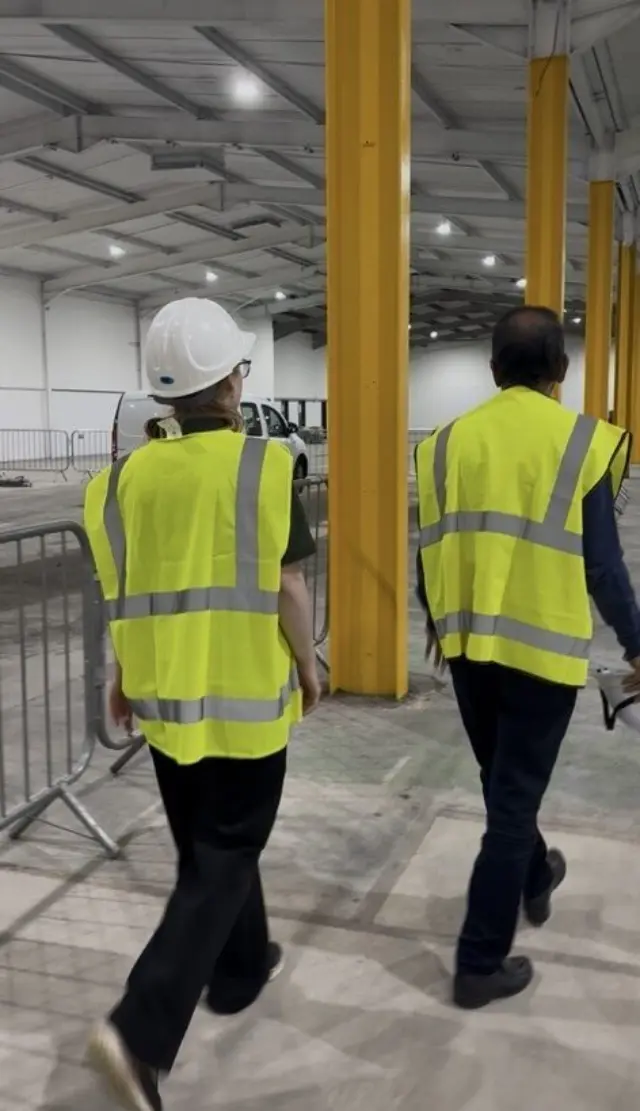 Two colleagues in hi-vis jackets auditing a site